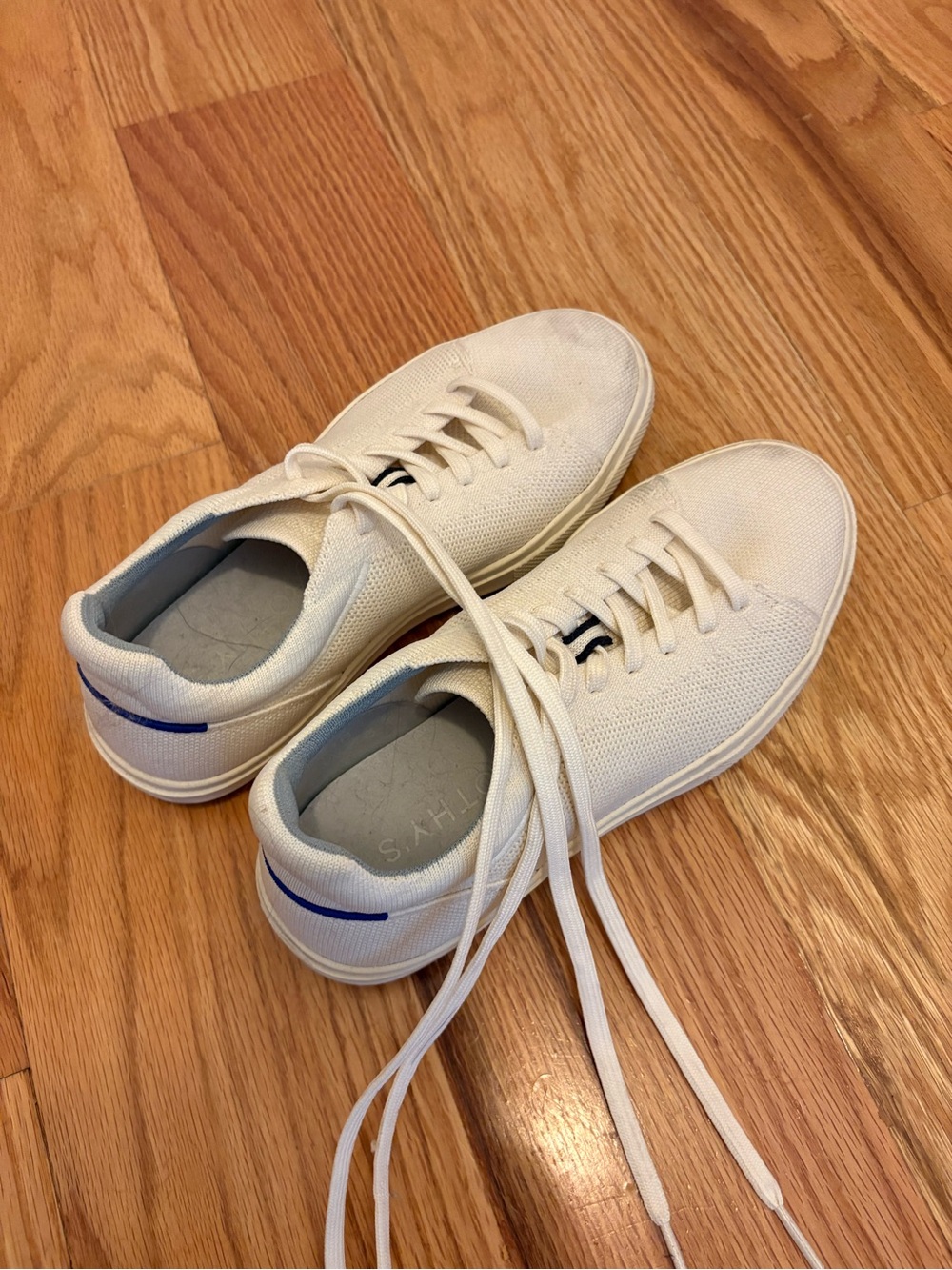 Rothy’s Casual White Canvas Sneakers with Blue Accent
